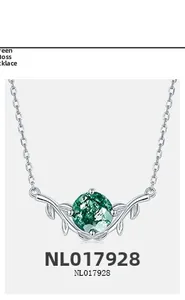 Detail of S925 silver necklace featuring a round green moss agate in leaf pendant