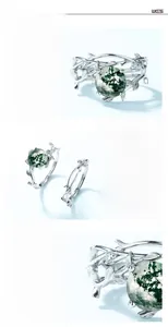 Detailed macro shot of S925 silver moss agate ring featuring unique twig-shaped design