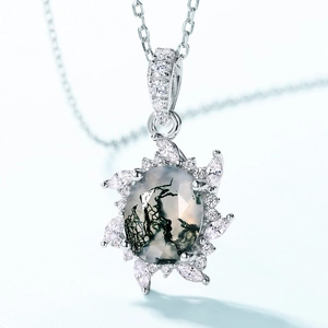 Elegant S925 silver moss agate necklace with sunflower white zircon frame on blue background