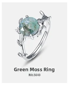 Detailed macro shot of Green Moss Agate ring featuring a silver leaf and branch design