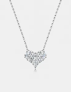 Macro shot of silver heart pendant necklace featuring sparkling cubic zirconia stones