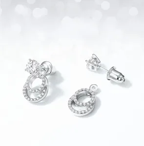 Macro shot of S925 silver moissanite earrings featuring detachable double ring pendants