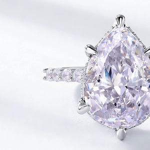 Pear-cut high carbon diamond ring in S925 silver with a pave-set band and claw setting