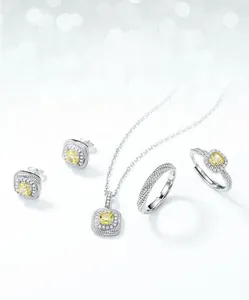 Macro shot of S925 silver jewelry set featuring cushion cut yellow carbon diamonds