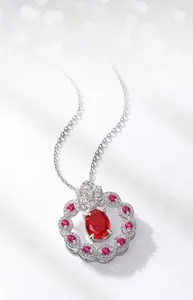 Macro shot of S925 silver necklace featuring a vibrant red oval carbon diamond pendant