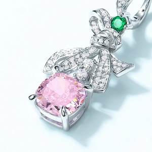 Boucles d'oreilles nœud en argent S925 avec gemme rose taille coussin et diamants