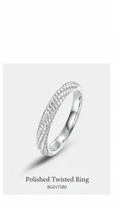 Macro shot of S925 sterling silver ring showing twisted texture and polished surface