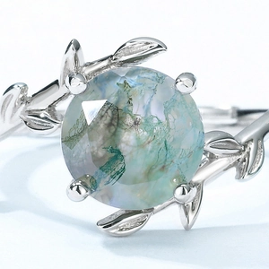 Elegant S925 silver ring featuring round moss agate in a branch and leaf design