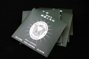 Macro shot of dark green professional nursing silver polishing cloth packaging
