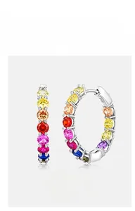 Macro shot of colorful zircon round hoop earrings with S925 silver metal engraving details