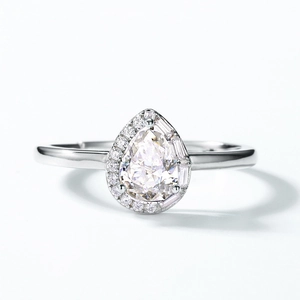 Pear cut moissanite ring with asymmetric round and baguette diamond halo in 925 silver