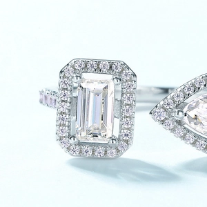 S925 silver open ring featuring emerald-cut green stone and pear-cut side gem