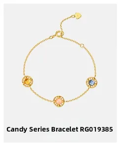 Detail of Candy Series gold bracelet with yellow, pink and blue gemstones and heart charm