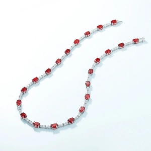 Luxurious S925 silver necklace featuring oval ruby red gems and halo diamond setting
