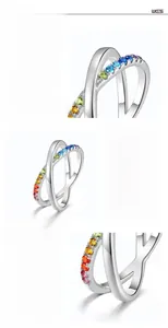 Detail of S925 silver cross ring featuring hand-set rainbow cubic zirconia and gold plating