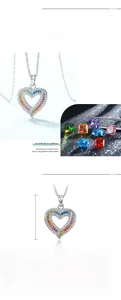 Macro detail of S925 silver heart necklace featuring colorful pavé zircon stones