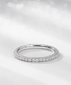 Macro detail of S925 sterling silver ring with full circle pavé cubic zirconia setting