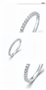 Macro detail of hand-set white zircons and polished S925 sterling silver ring plating