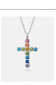 Detailed close-up of S925 silver rainbow cross pendant with colorful zircon stones