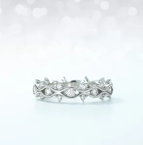 Detailed close-up of wavy S925 sterling silver ring featuring pavé-set moissanite stones