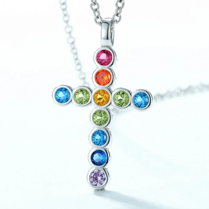 Sterling silver rainbow cross necklace with colorful zircon stones on a delicate O-chain