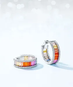 Macro detail of S925 sterling silver hoop earrings with multicolored cubic zirconia stones