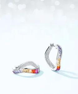 Macro view of S925 sterling silver wavy earrings with rainbow cubic zirconia stones