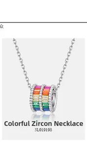 Detailed macro view of S925 silver necklace with rainbow baguette-cut zircon cylinder pendant
