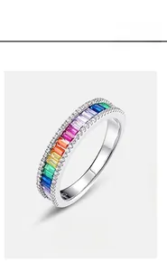 Macro shot of S925 silver ring featuring channel-set rainbow rectangular cubic zirconia