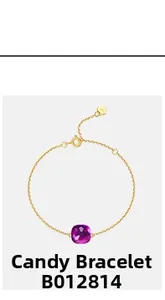 Detail of candy-colored purple gemstone bracelet with 18K gold plated chain and heart tag