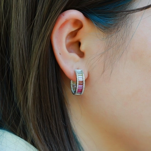 Rainbow hoop earrings in 925 silver with colorful zircons worn by an Asian model