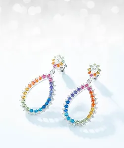 Macro shot of S925 silver earrings with gradient rainbow cubic zirconia stones