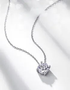 Macro shot of a six-prong moissanite pendant on a silver O-chain with bokeh background