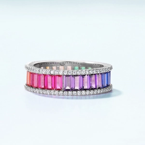Rainbow gradient zircon ring with baguette cut stones and white accents in silver finish