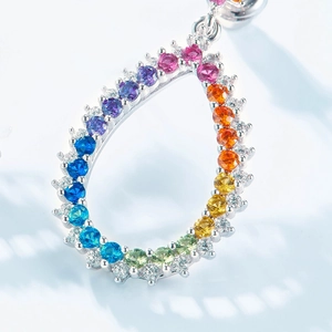 Teardrop navel ring with rainbow gradient crystals and silver pavé micro-inlay frame