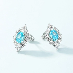 Elegant 925 silver studs with oval light blue stone and sparkling zircon halo