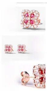 Macro detail of S925 silver four-leaf clover earrings with red rubies and rose gold plating