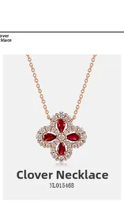 Detailed view of S925 silver four-leaf clover pendant with red gems and pavé crystals