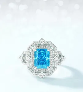 Macro shot of rectangular blue carbon diamond with dual-layer halo setting on S925 silver ring