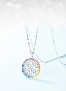 Macro detail of S925 silver pendant with rainbow cubic zirconia and Celtic knot design