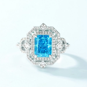 Luxurious S925 silver ring featuring a radiant cut light blue sapphire and halo diamonds