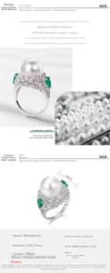 Macro shot of 12.5mm white shell pearl ring with S925 silver and emerald green stones