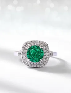 Macro detail of high carbon emerald green gemstone ring with pavé diamond accents