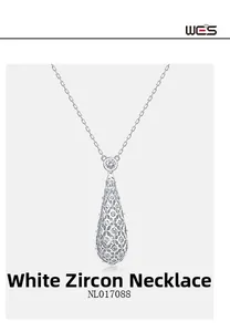 Macro shot of silver hollow teardrop pendant with micro-set white cubic zirconia crystals