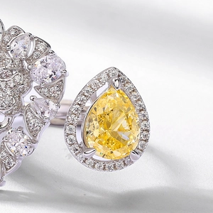 Luxury S925 silver ring featuring a large pear-cut yellow diamond and cluster of white stones