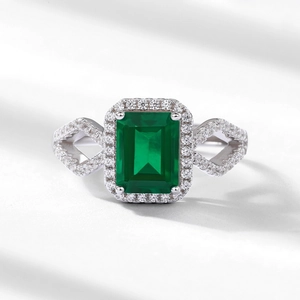 Octagon emerald ring in S925 sterling silver with halo diamonds and geometric hollow band