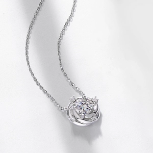 Macro shot of silver S925 necklace with spiral pendant and sparkling moissanite stone