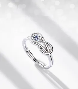Close-up of S925 silver moissanite ring featuring a geometric knot and adjustable band