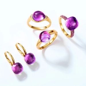 S925 silver jewelry set with gold plating and purple gemstones on white background
