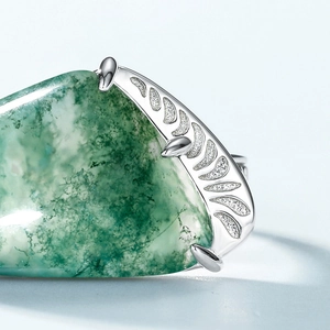 S925 silver ring featuring natural green moss agate with ornate leaf side engravings